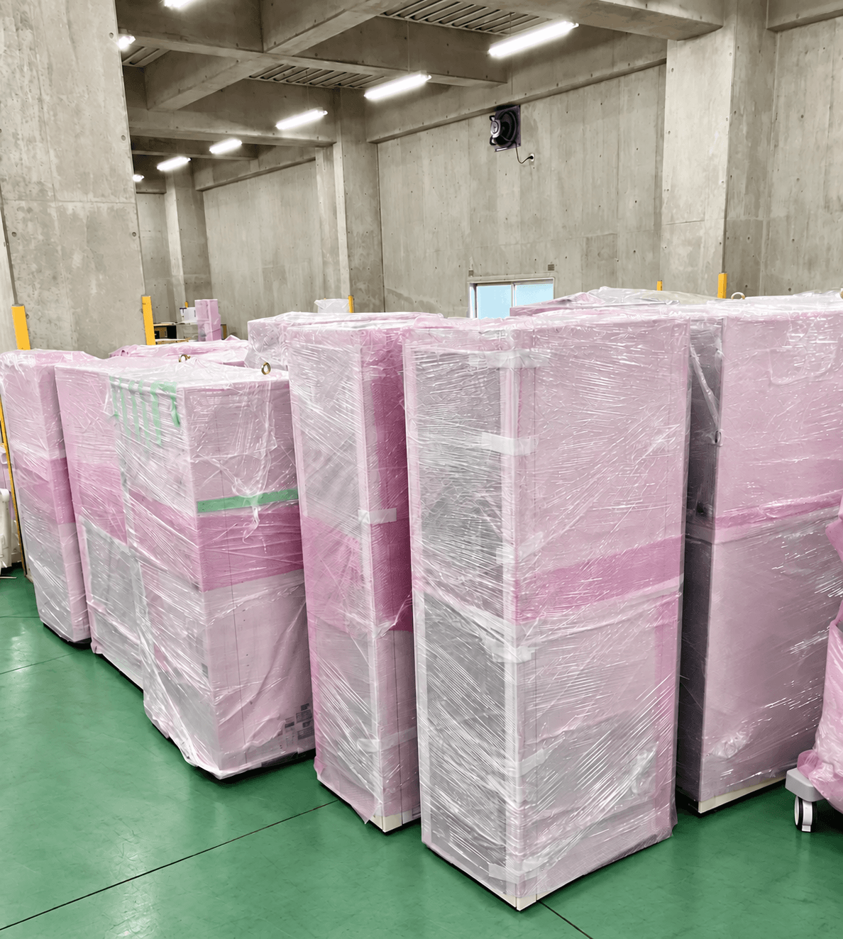 Film-wrapped systems lined up in the warehouse