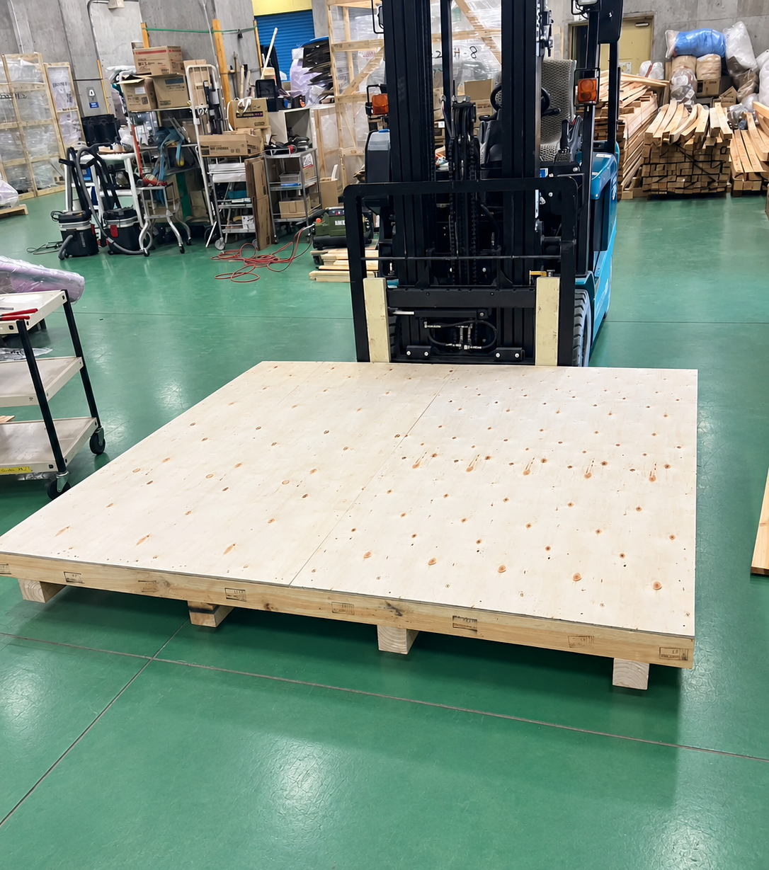 A large packing pallet with a forklift