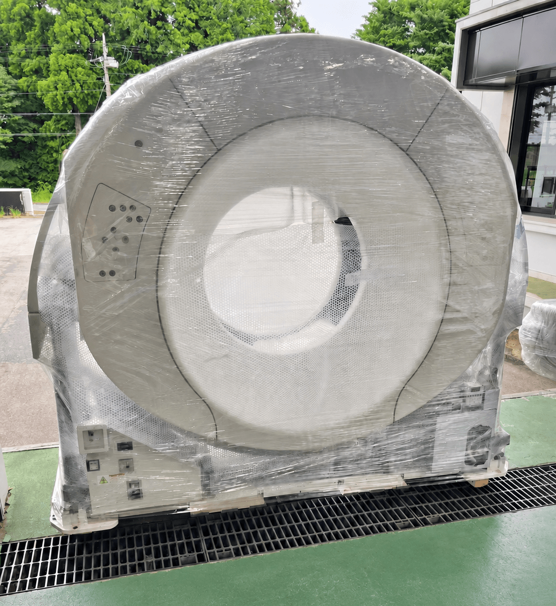 A film-wrapped imaging system being received