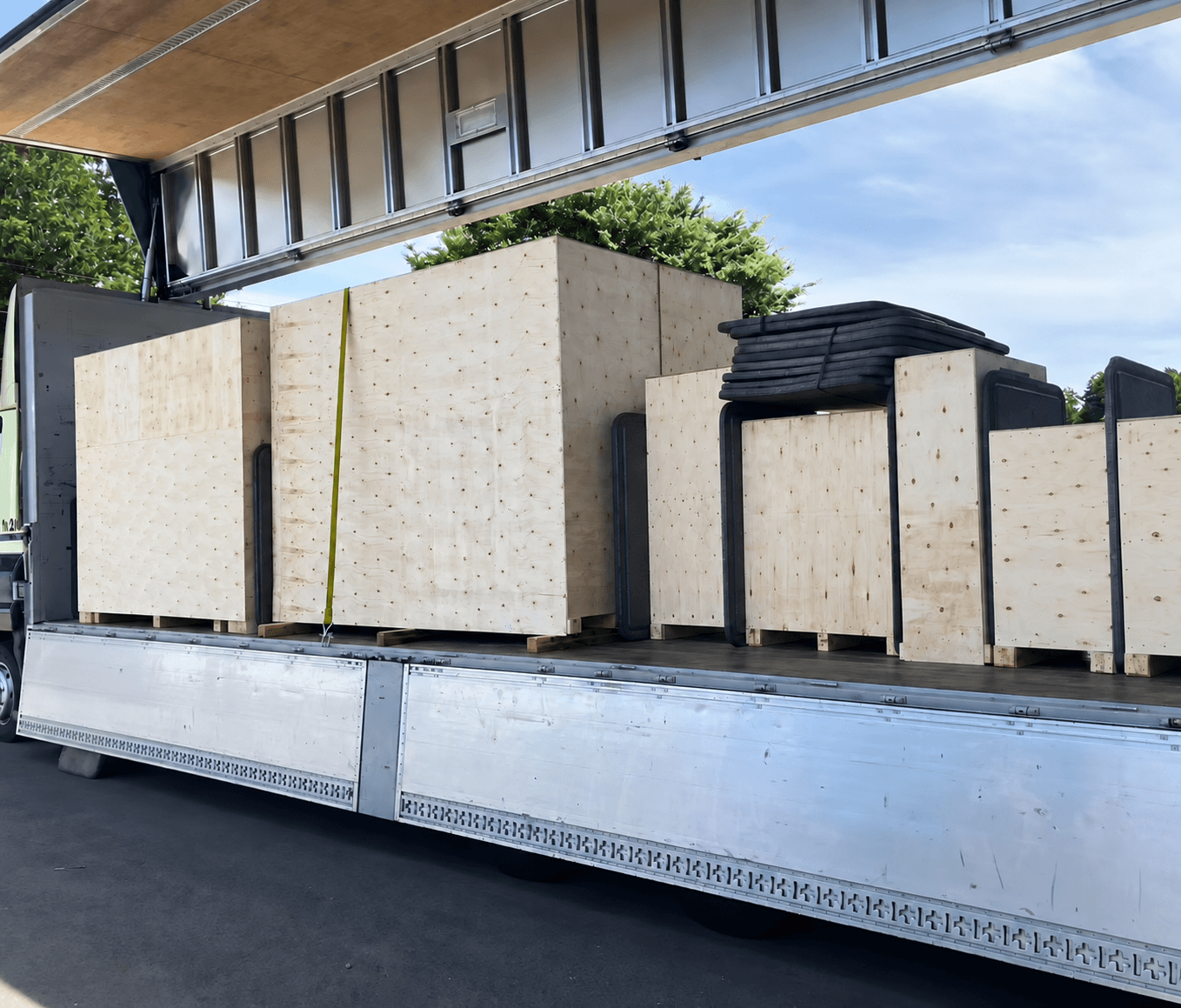 Timber-crated systems being loaded onto a truck