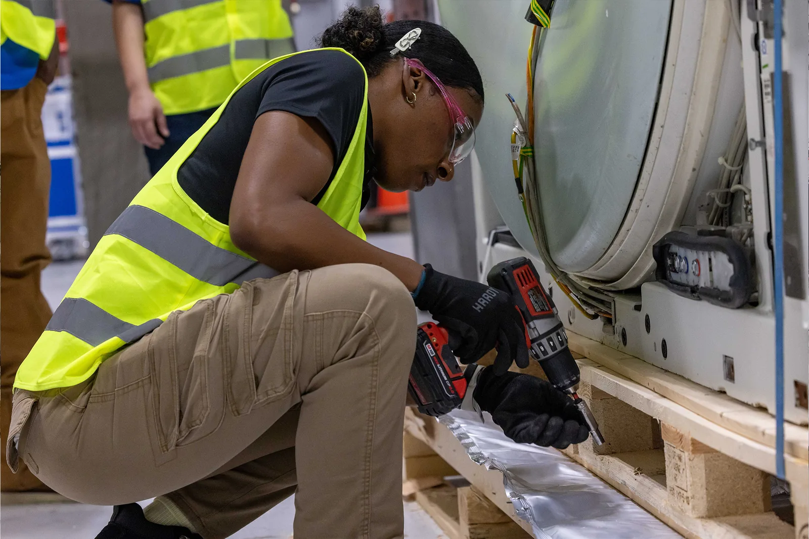 Technician securing and adjusting equipment during install